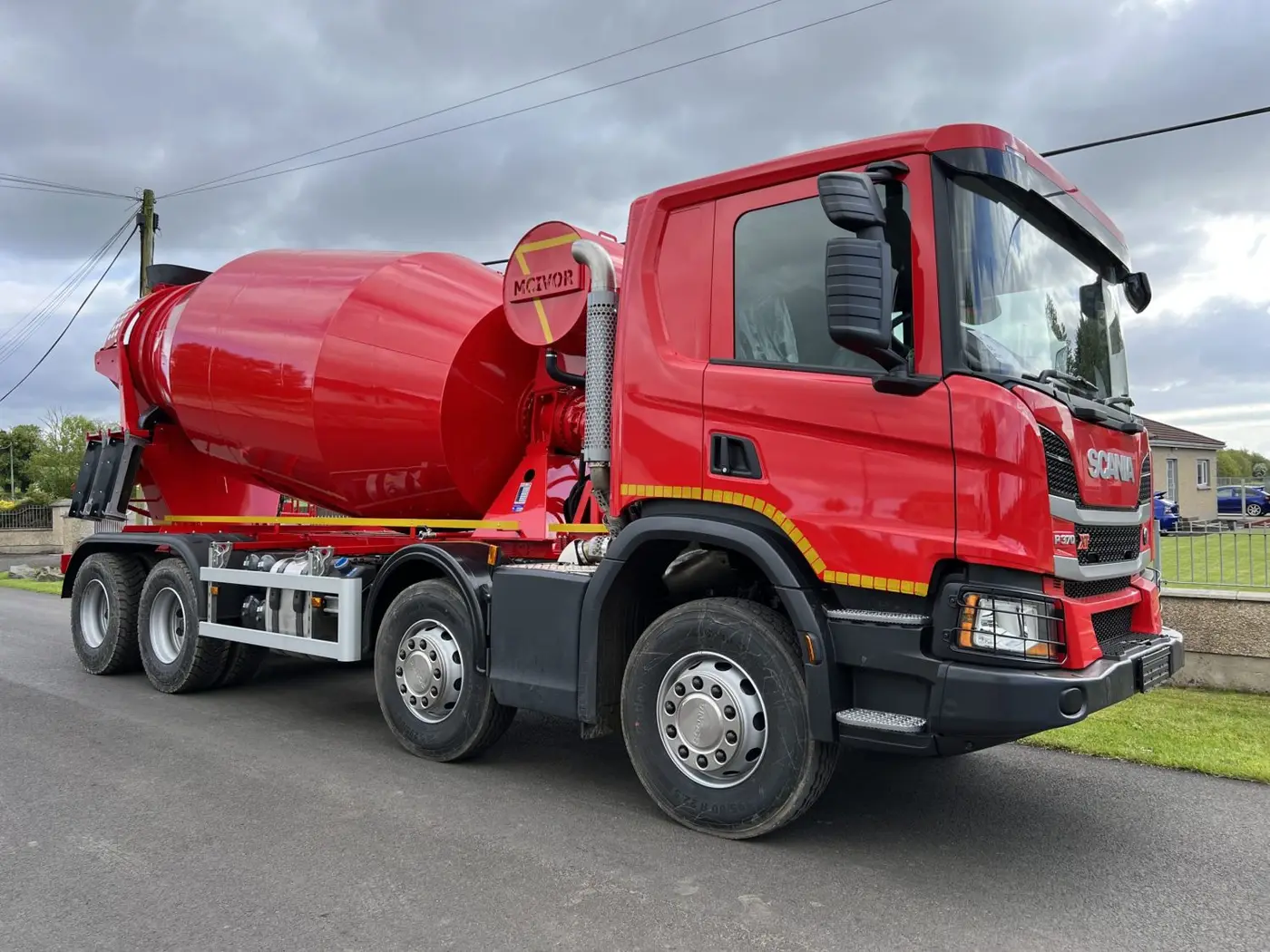 Full length view of concrete truck mixer in open space