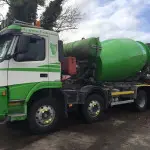Truck mixer with hydraulic drive system visible