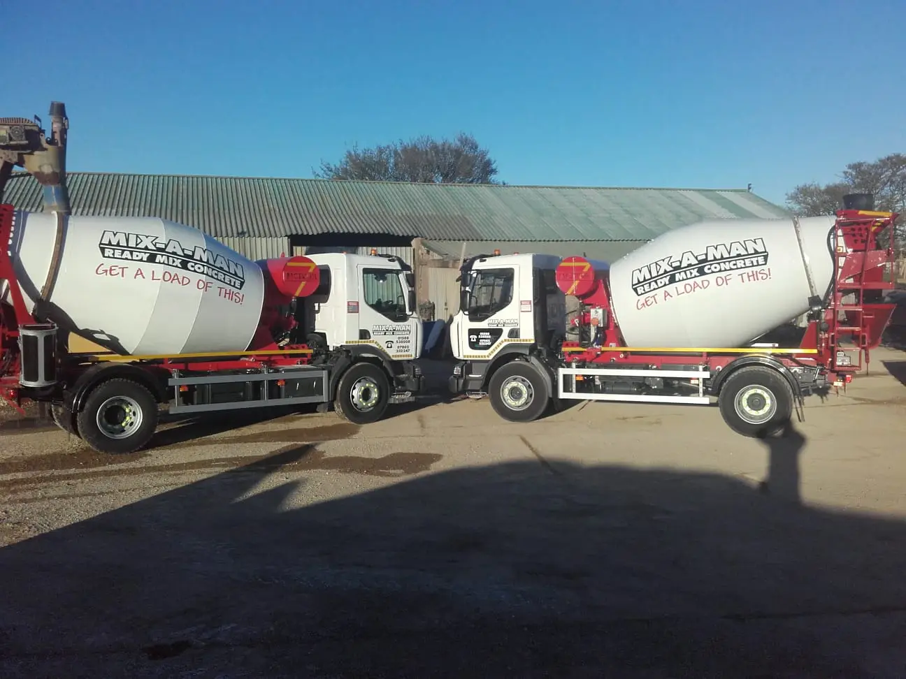 Wide view of two truck mixer outdoors Northern Ireland