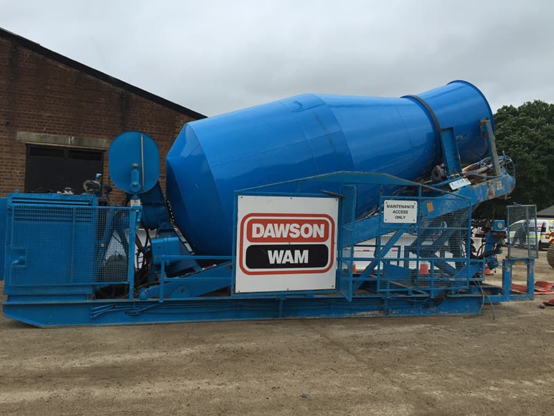 Large truck mixer delivering concrete to site